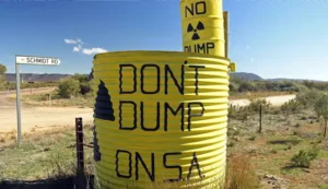 large dumps painted with dont dump on SA by an arid dirt road