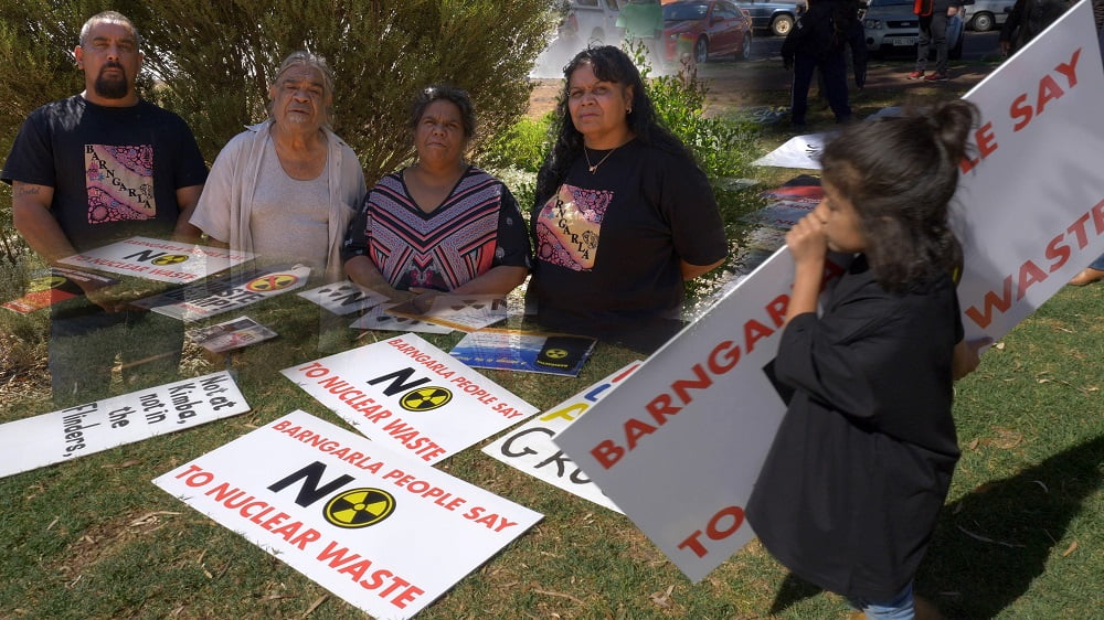 Barngarla community members gather around anti-nuclear placards